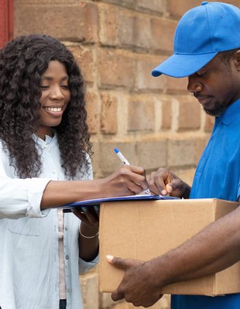 close-up-delivery-person-giving-parcel-client